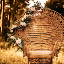 Load image into Gallery viewer, pink peony and eucalyptus floral wedding garland draped across large peacock chair by Taylor&#39;s Touch Floral
