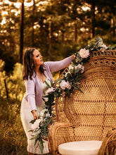Load image into Gallery viewer, attaching a floral garland to a rattan chair by Taylor&#39;s Touch Floral
